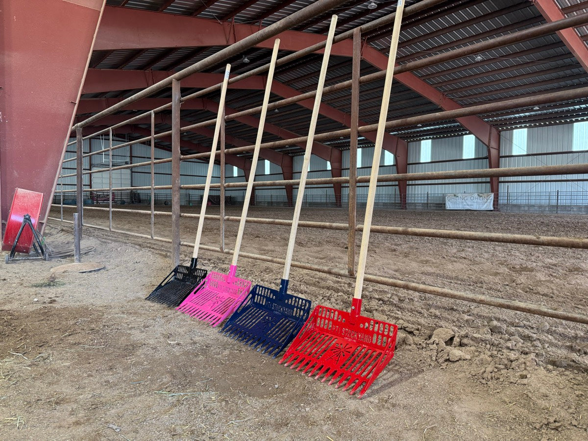 PTI Stock Yard stall forks lined up against an arena rail